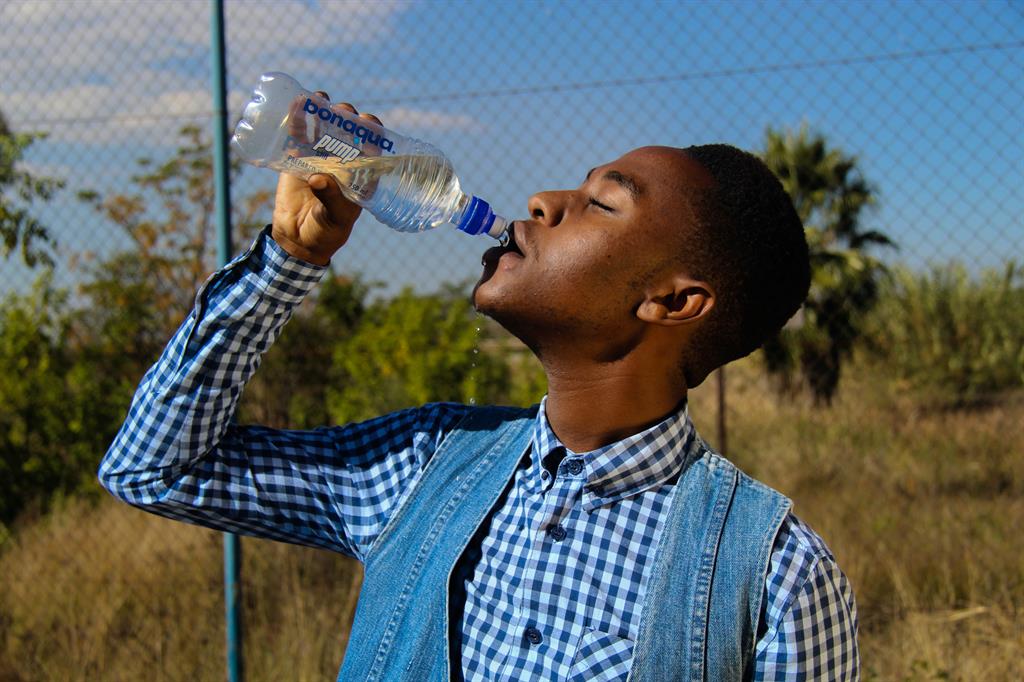 Man drinking from a water bottle